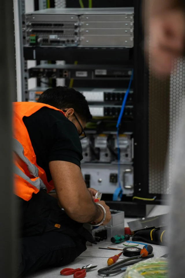 A technician working on server equipment